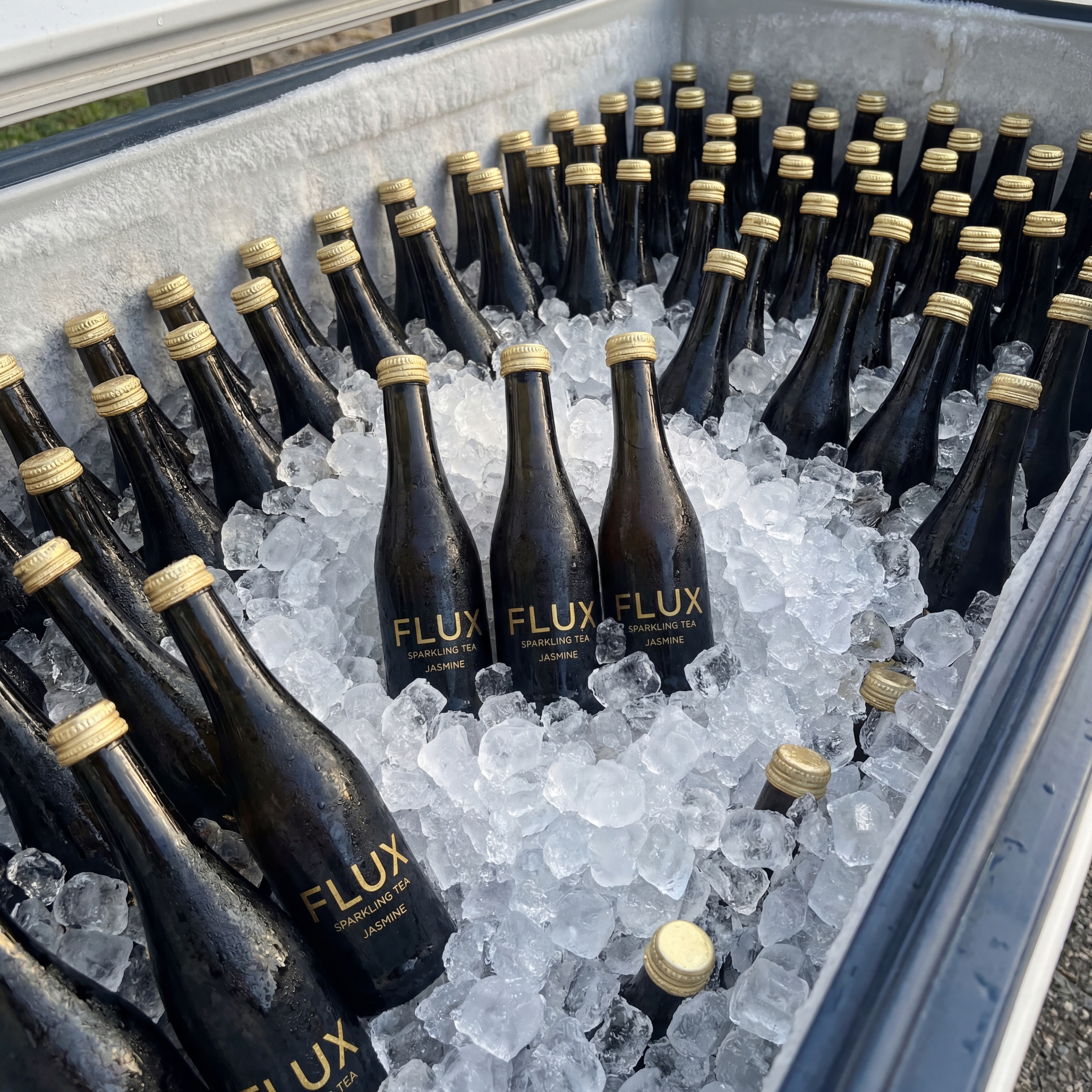 FLUX sparkling tea bottles on ice